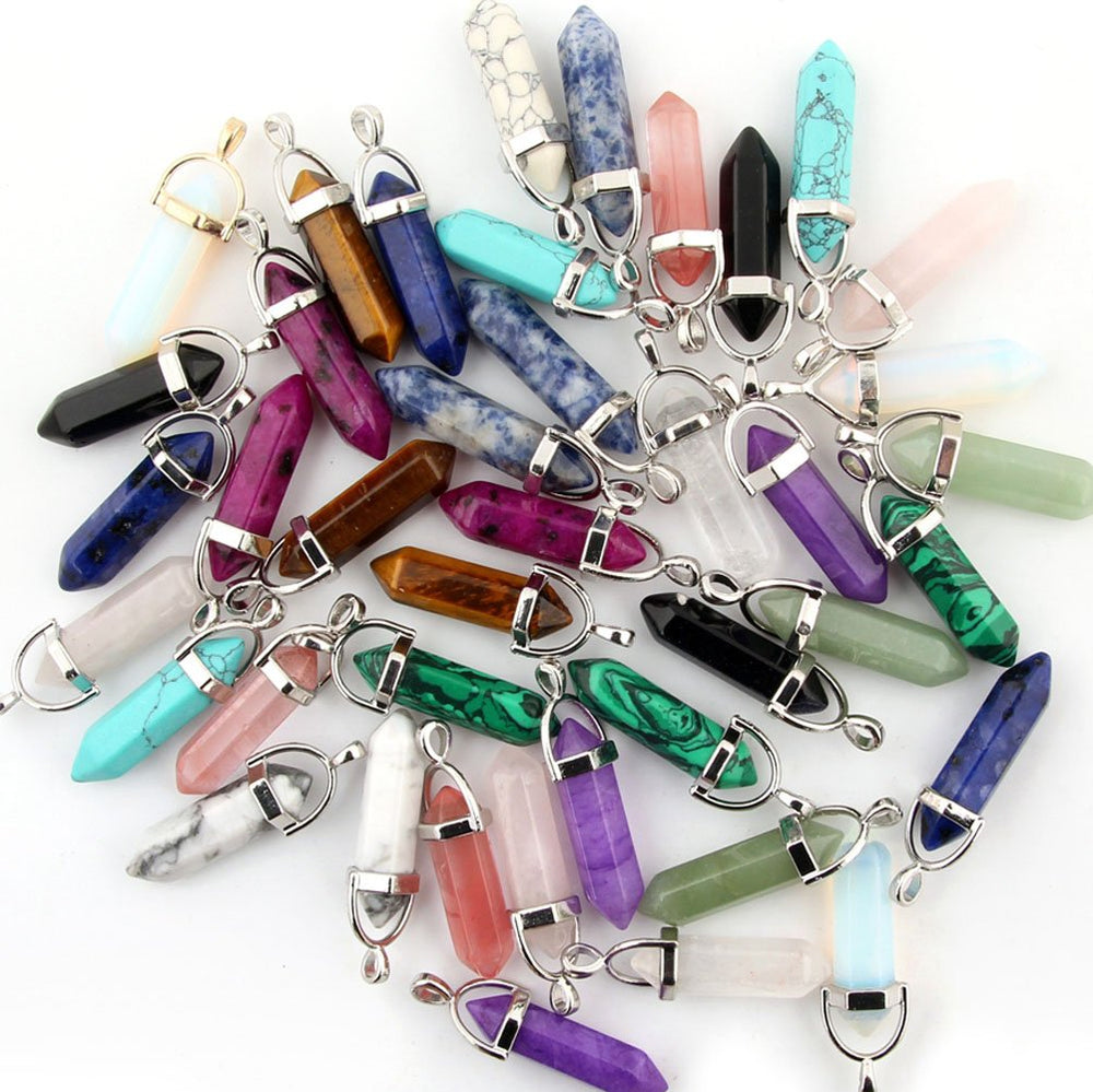 Cmidy chakra pyramid healing points pendants closeup in varied colors for crafts.