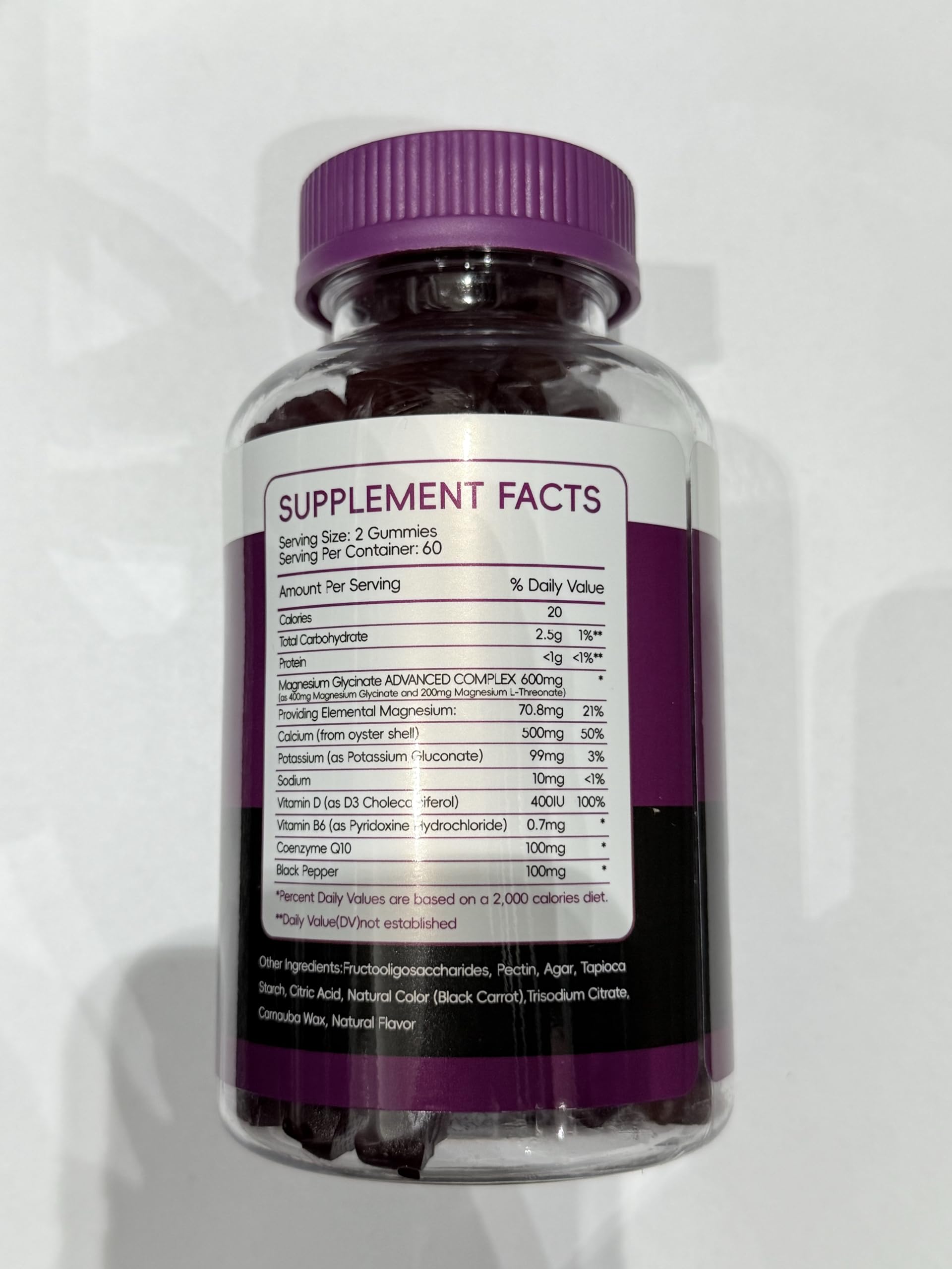 Person taking CNFHDI gummies as part of a morning routine.