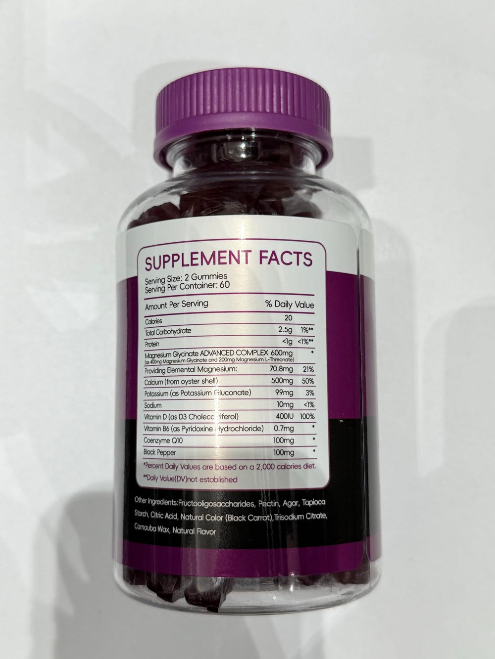 Person taking CNFHDI gummies as part of a morning routine.