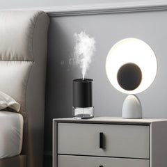 Cocoarm touch-control diffuser shown in action for easy mist customization.