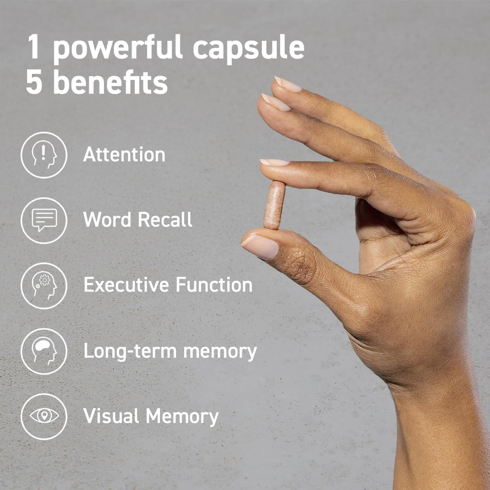 CocoaVia Memory & Focus capsule held in hand for easy daily use.