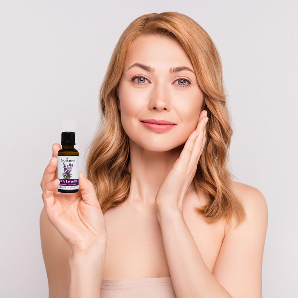 COCOCARE lavender oil bottle beside a warm bath setup.