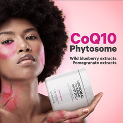 Codeage mixed berry flavored powder shown in a glass.