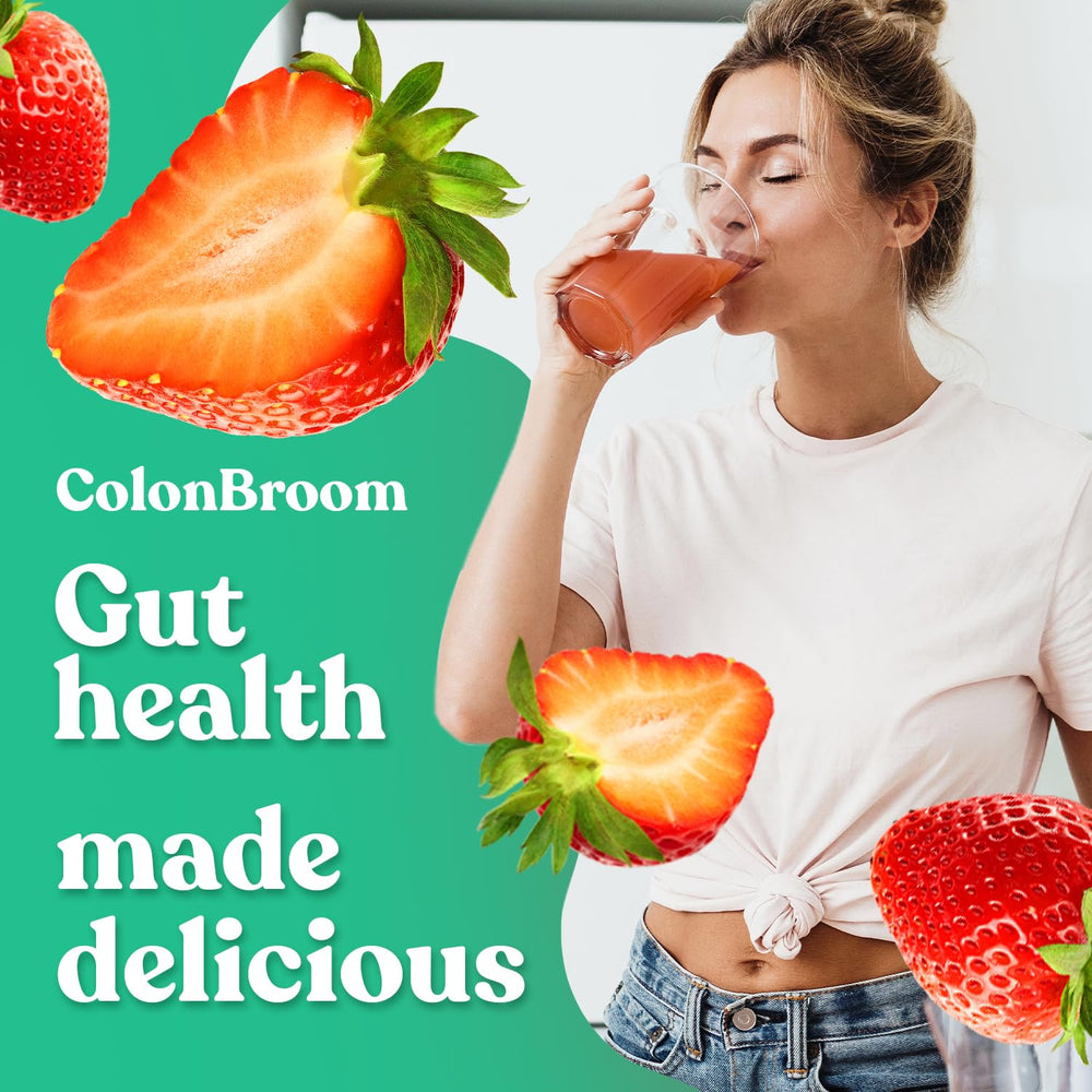 Pouring ColonBroom strawberry powder into glass for a berry fiber boost
