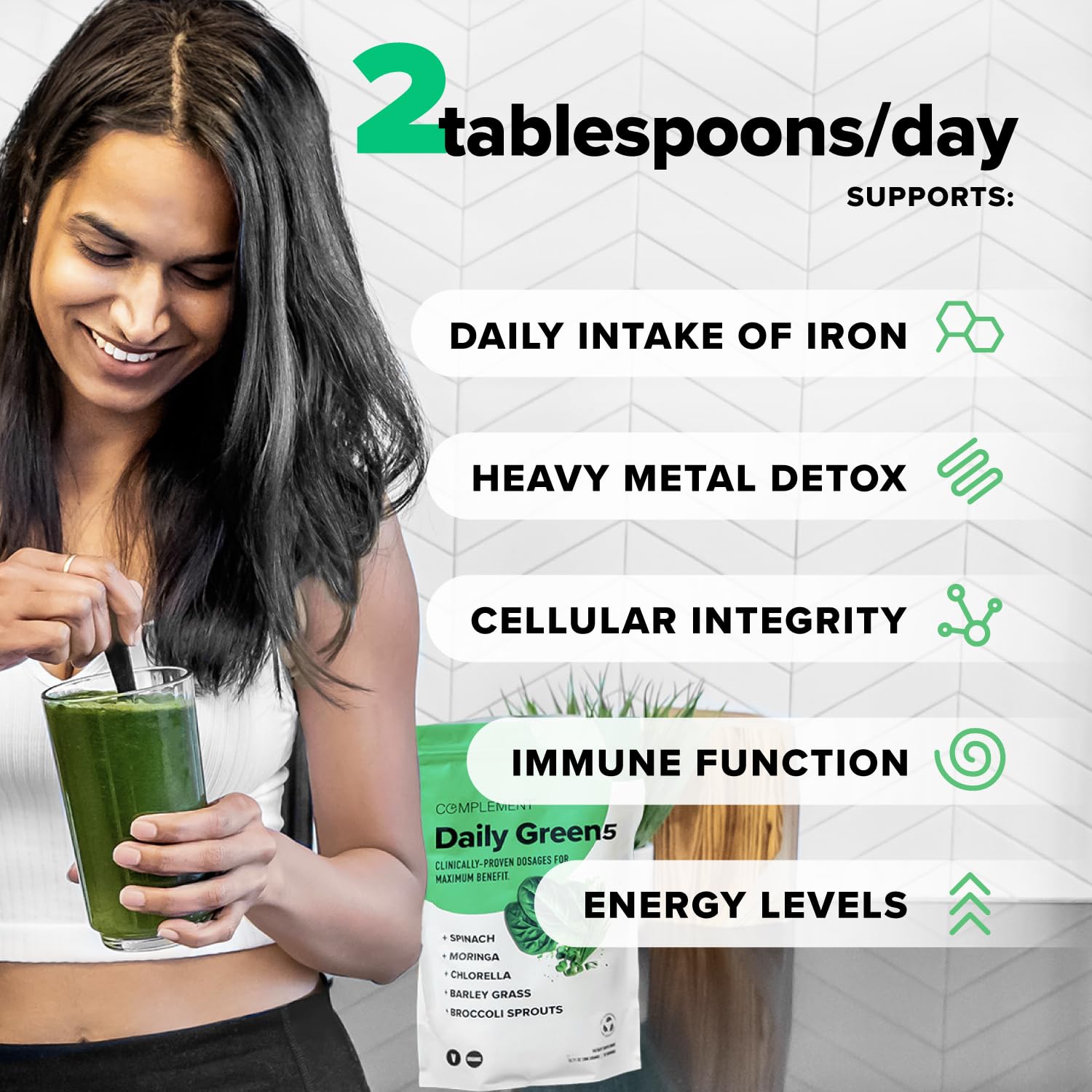Complement Daily Greens powder ingredients close-up featuring spinach, chlorella, and moringa