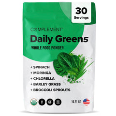 Complement Daily Greens powder tub close-up showing a plant-based blend for daily use