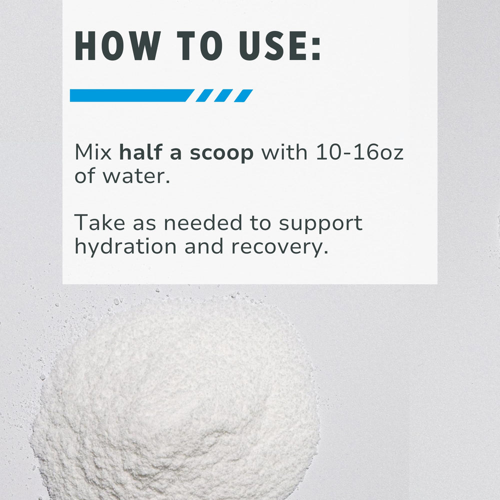 Glass with CON-CRET hydration mixed in water, Citrus Mango flavor.