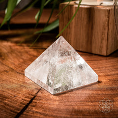 Conscious Items Clear Quartz Pyramid glowing softly to illuminate spaces and support calm focus.