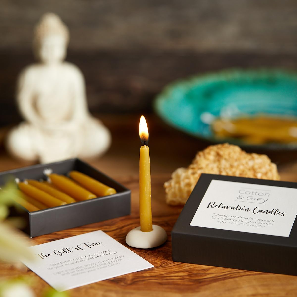 Ceramic holder with Cotton & Grey candles offers an elegant, stable display.