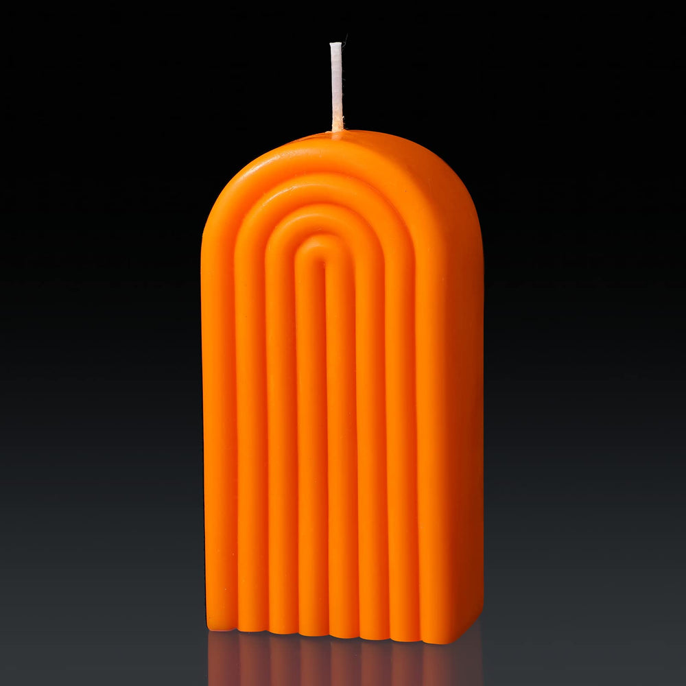 Coume arch shaped candle in orange adds warm ambience to any room.