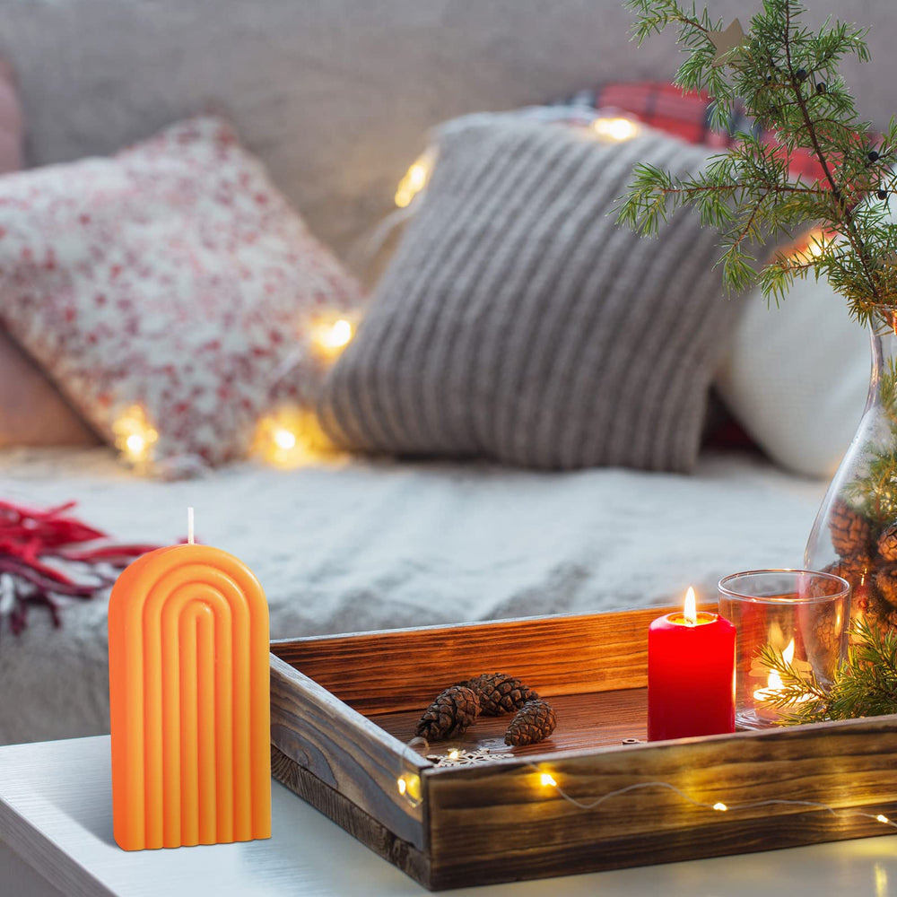 Decorative orange candle by Coume ideal for gifting and celebrations.