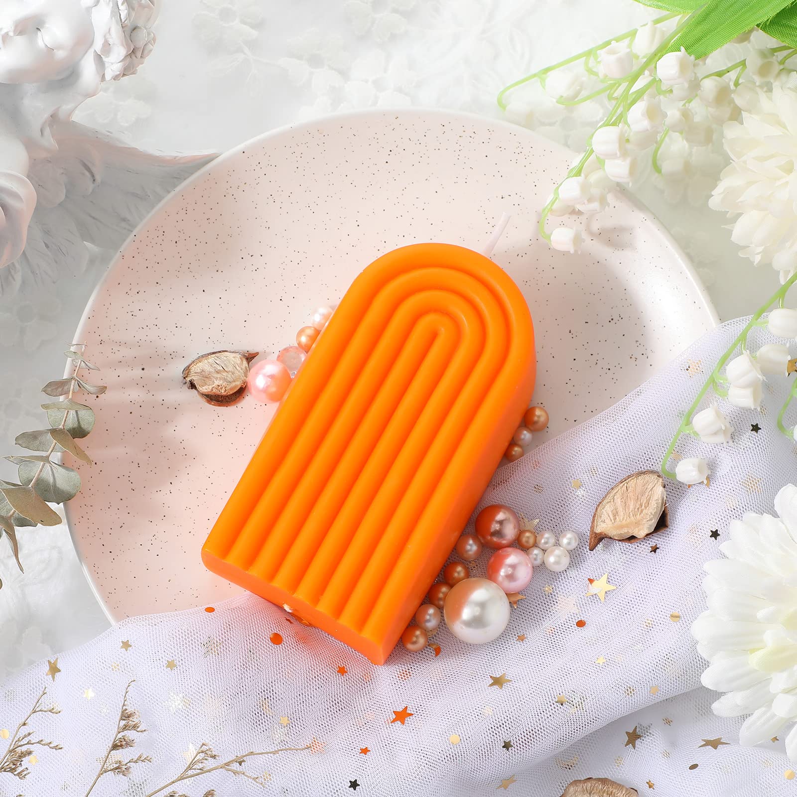 Coume soy wax candle in orange for a steady, cozy flame.