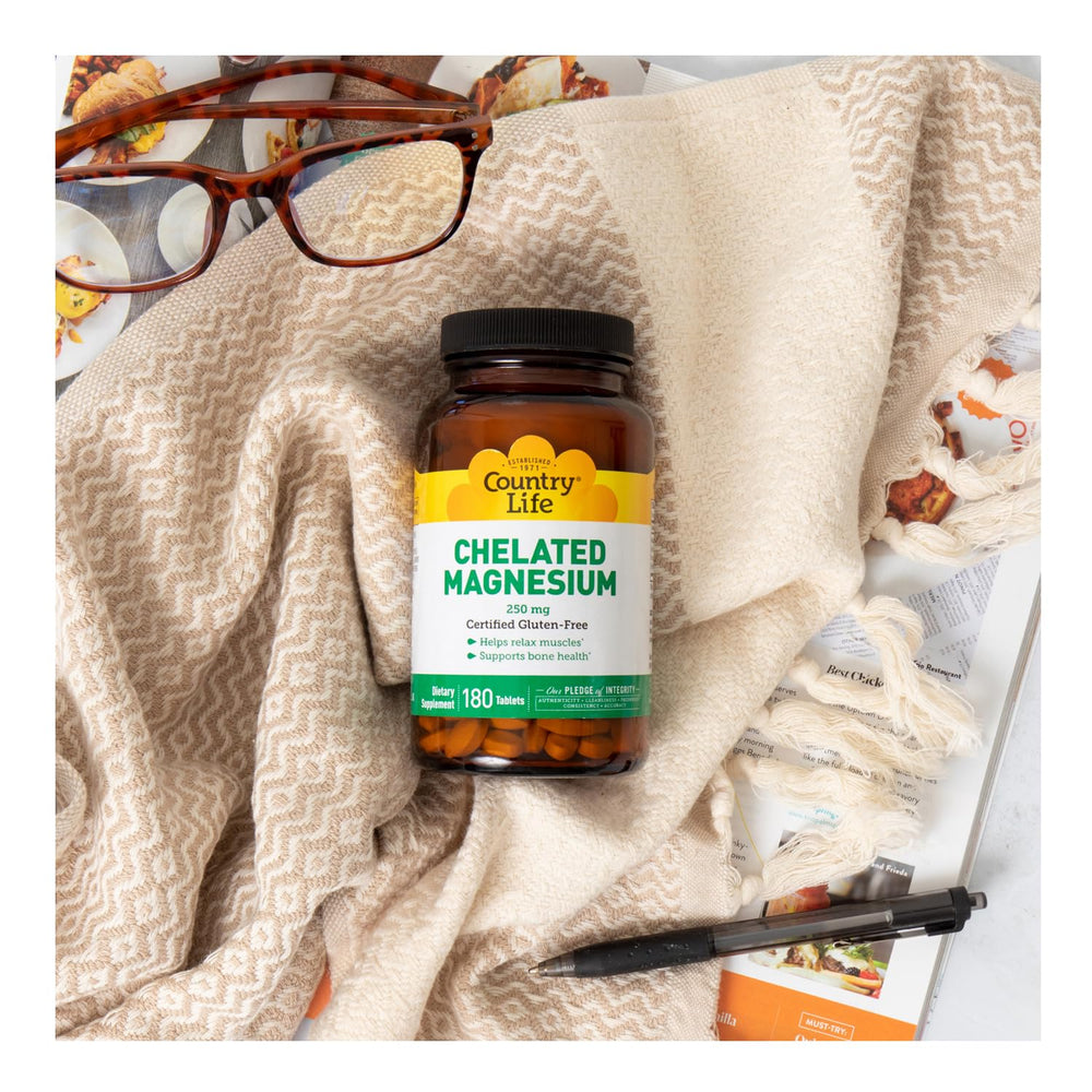 Country Life Chelated Magnesium 250mg bottle on desk demonstrates daily health support