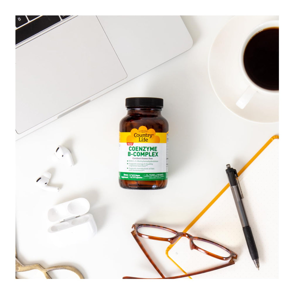 Country Life Coenzyme B-Complex beside a glass of water for quick daily support.