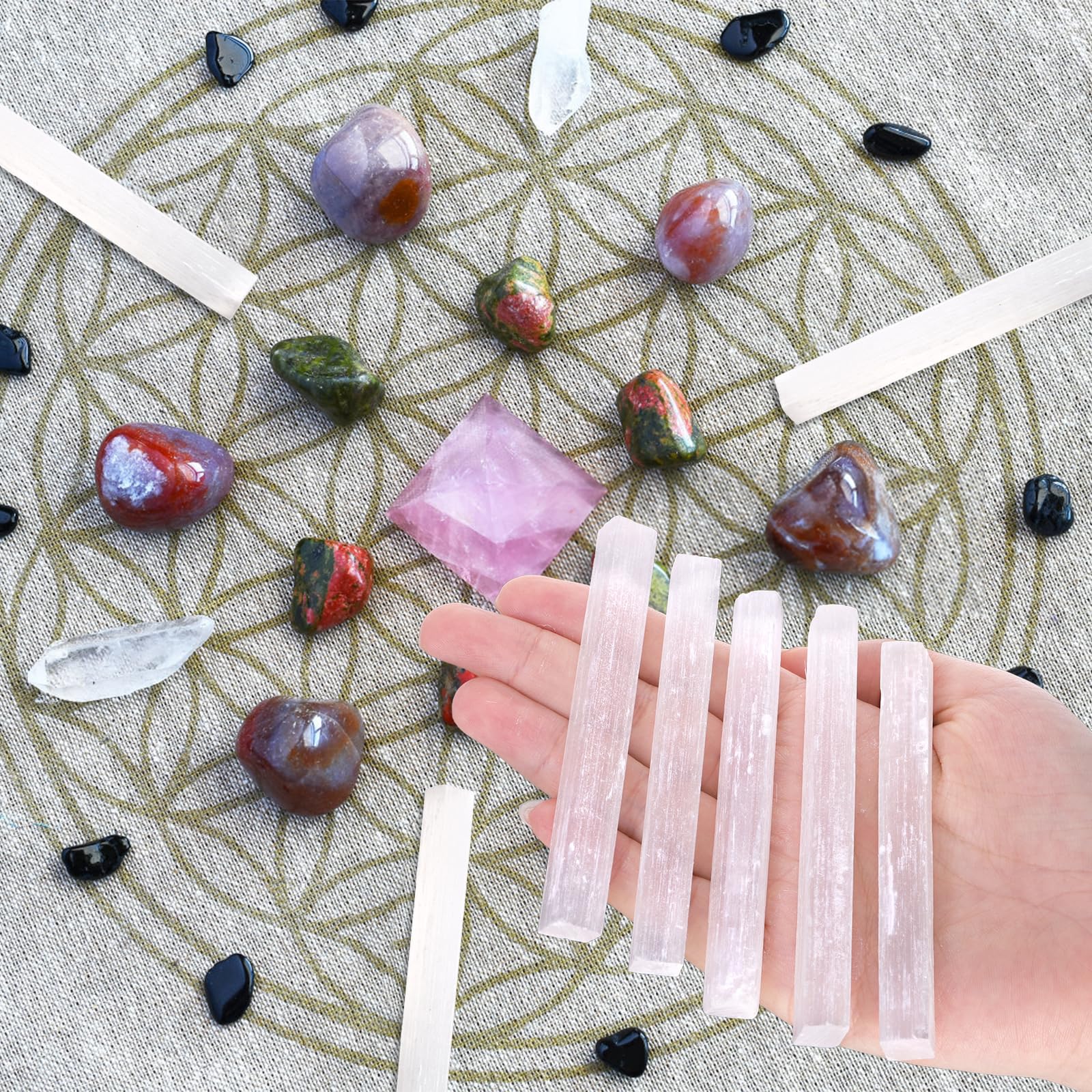 Close-up of Covzoe selenite sticks showing smooth texture and soft glow