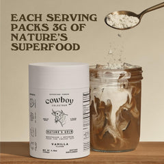 Cowboy Colostrum Powder scoop showing easy measurement for daily use