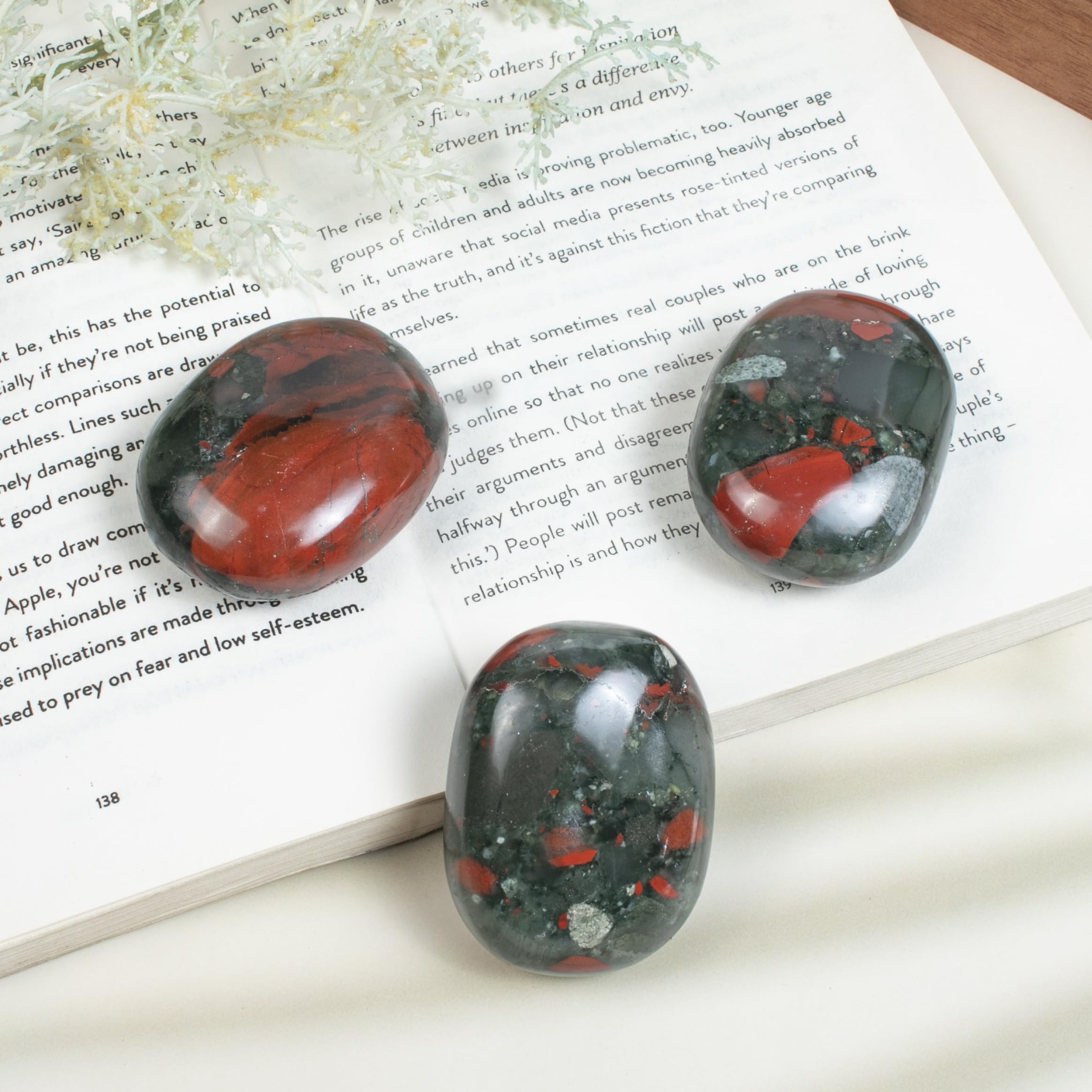 Crocon African Bloodstone palm stone shown as a thoughtful gift display