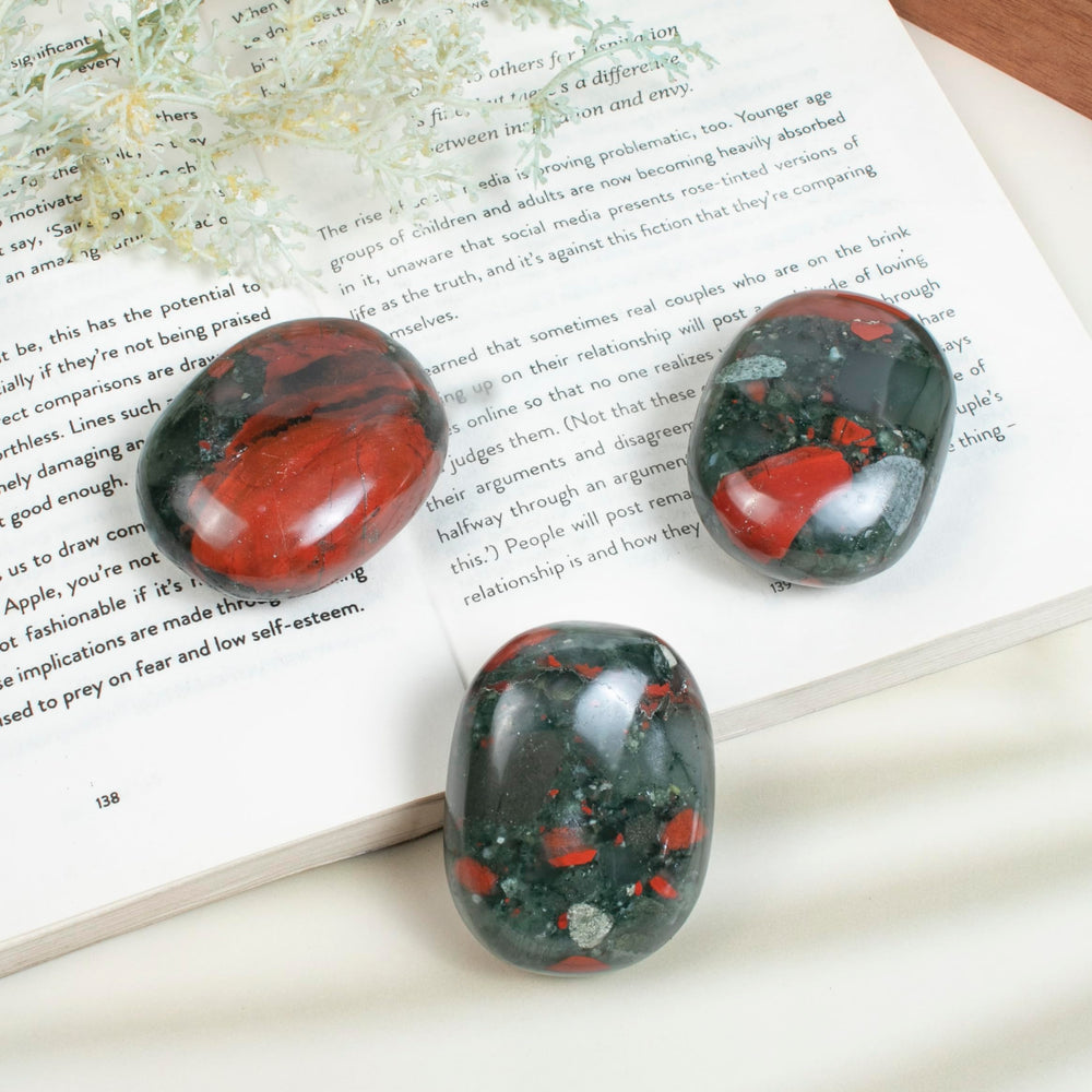 Crocon African Bloodstone palm stone shown as a thoughtful gift display
