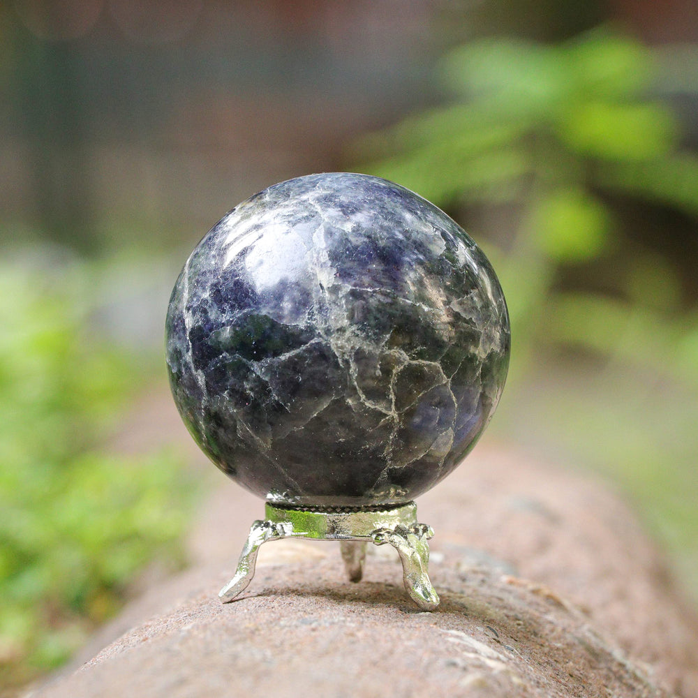 Crocon iolite gemstone closeup highlighting its deep blue hues.