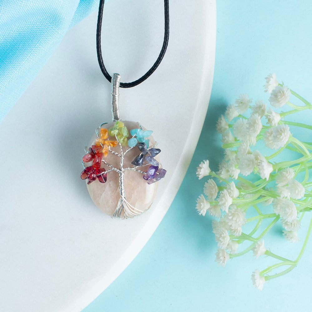 Crocon Peach Moonstone Necklace close-up reveals artisan wire wrap and gentle shimmer.