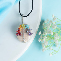 Crocon Peach Moonstone Necklace close-up reveals artisan wire wrap and gentle shimmer.