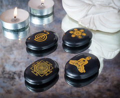 Crocon Reiki symbol palm stone engraved with chakra symbol for balance.