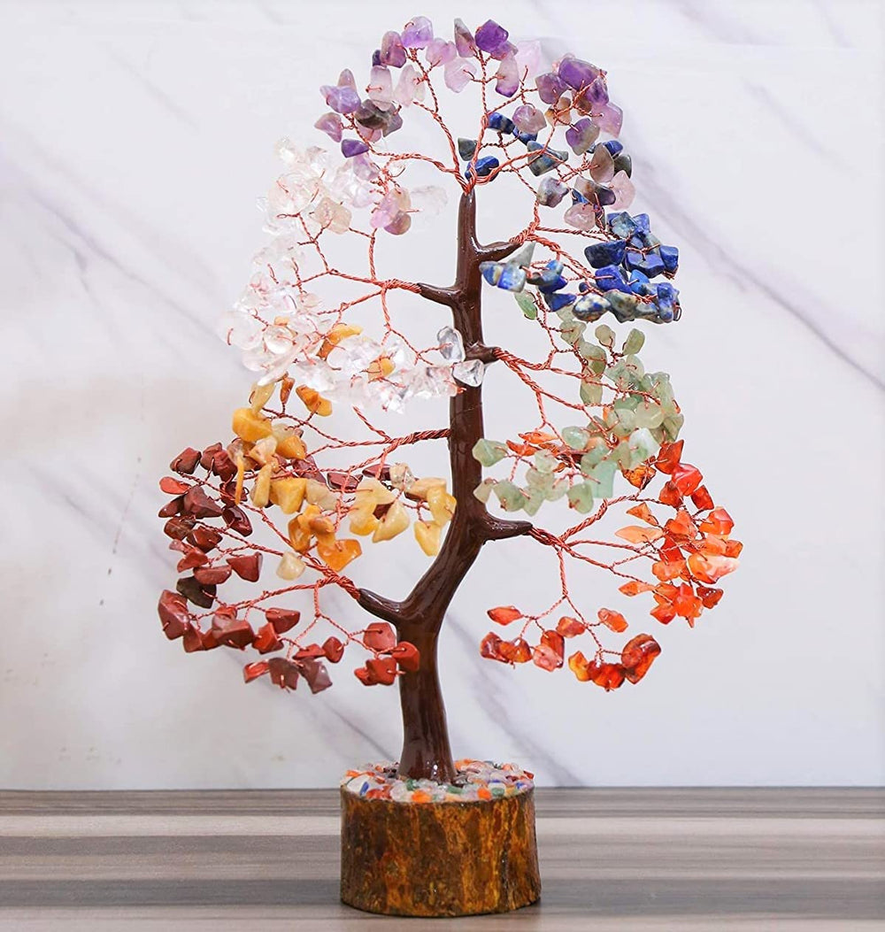 Crocon seven chakra crystals arranged on a money tree for balance.