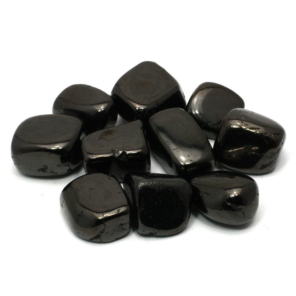 CrystalAge Jet tumble stone for grounding and cleansing energy on the go.