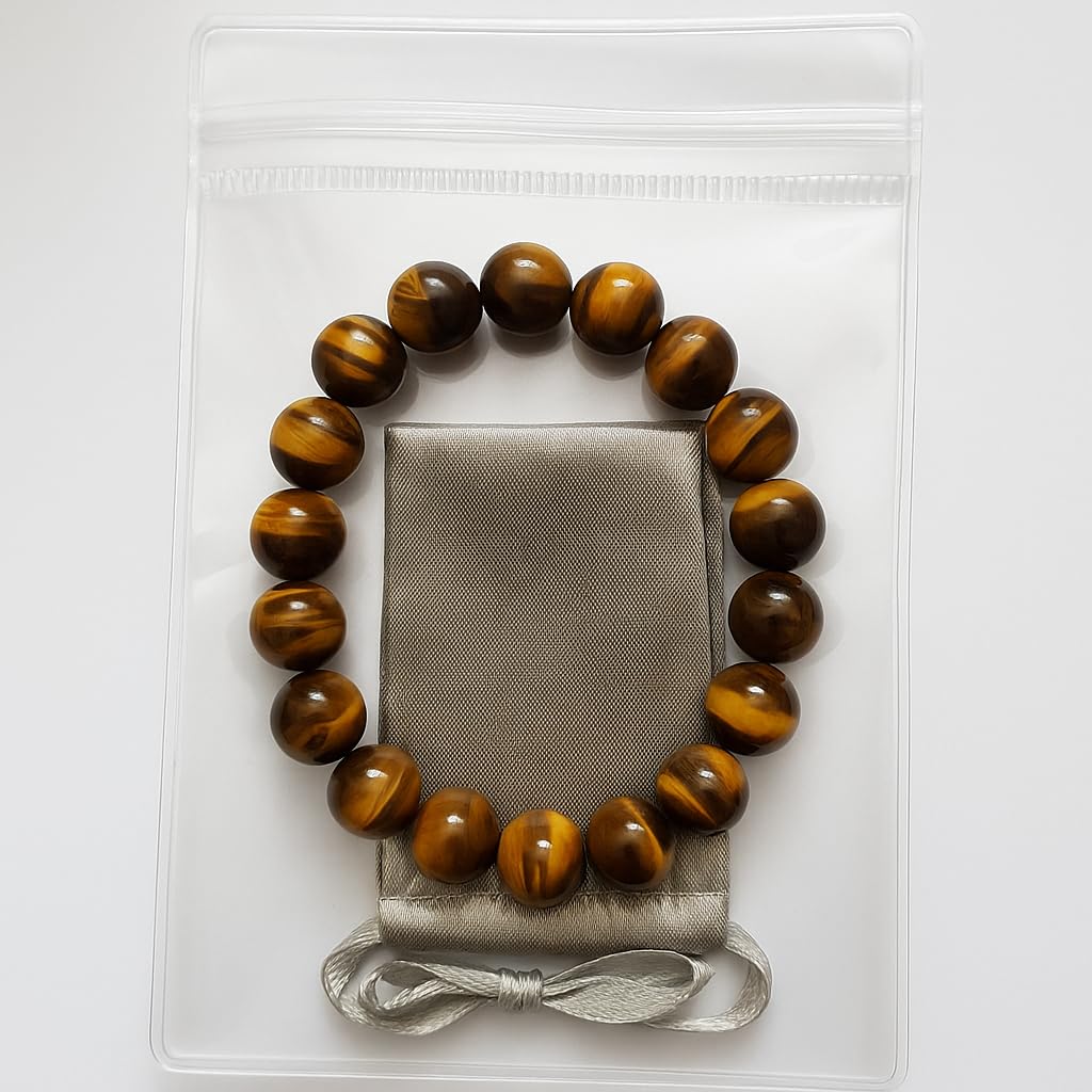 CrystalHouzz Tiger Eye Bracelet on wrist shows comfortable fit for work and travel.