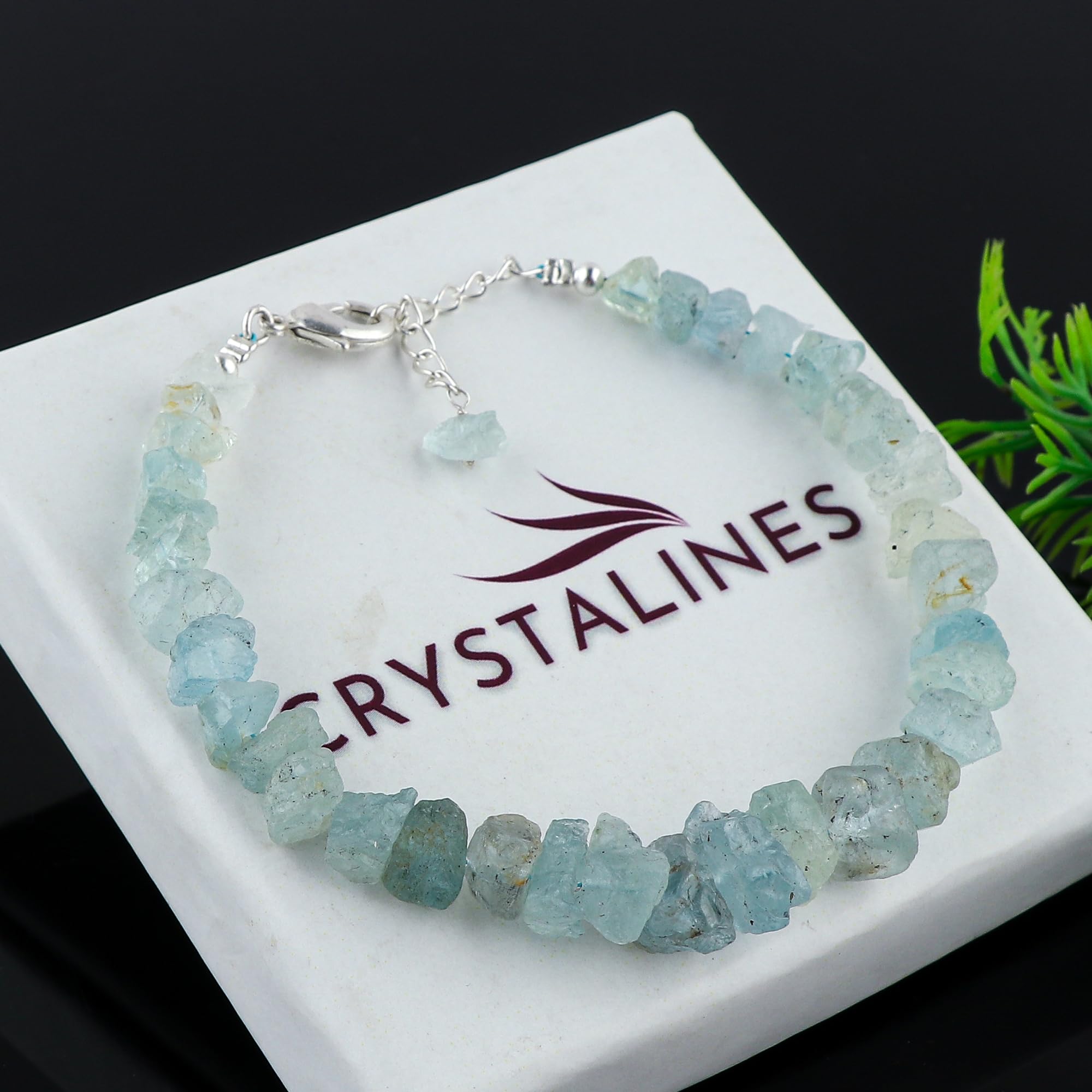 Closeup of CRYSTALINES aquamarine rough beads highlighting unique textures for versatile looks