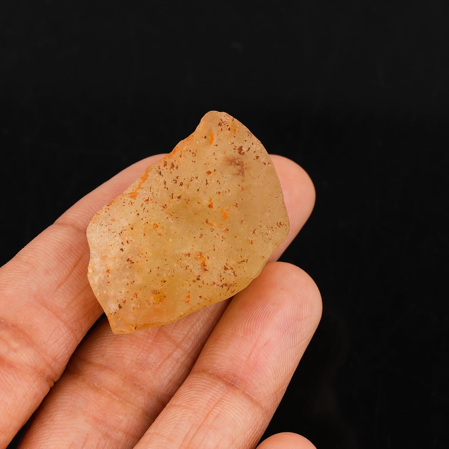 CRYSTALINES Libyan Desert Glass golden color captures light with warm glow.