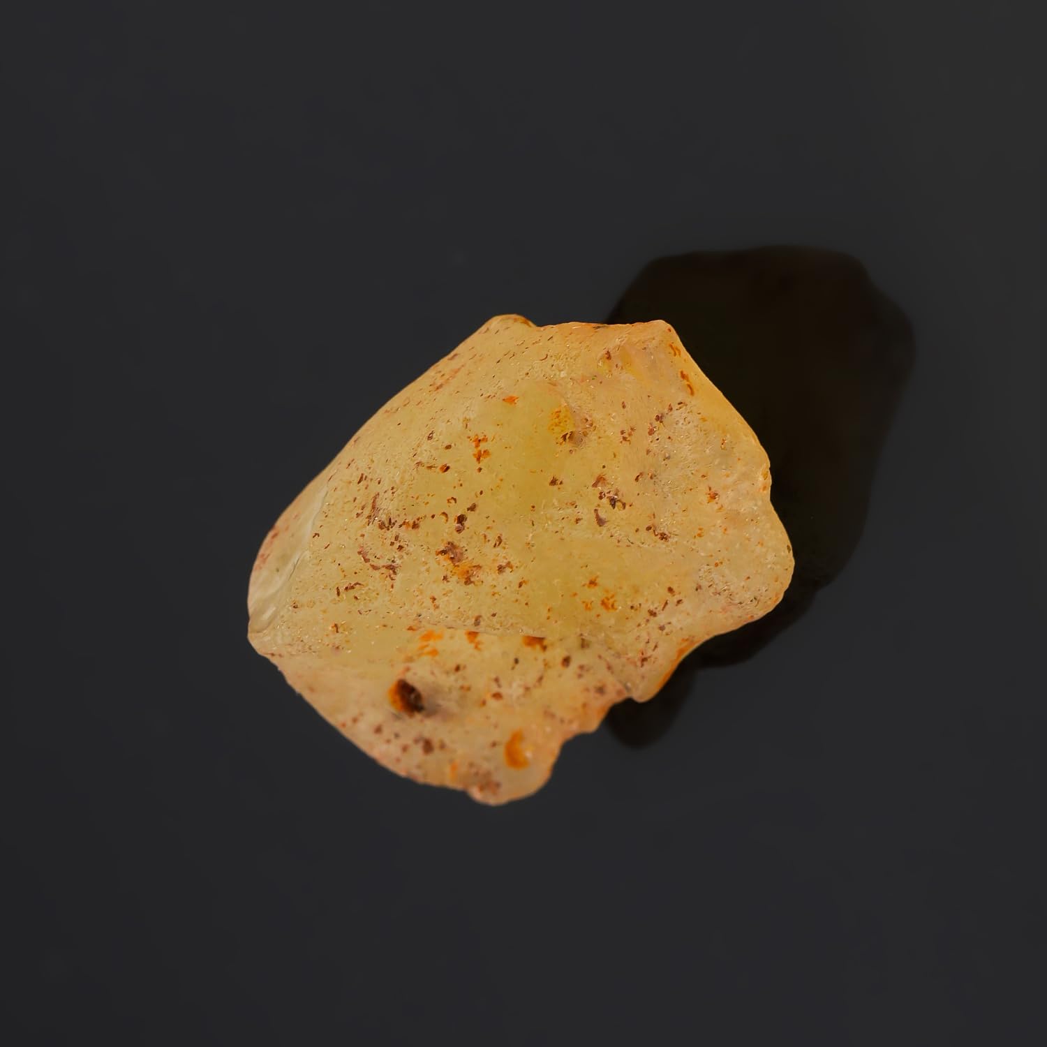 CRYSTALINES Libyan Desert Glass with vitreous luster on natural surface.