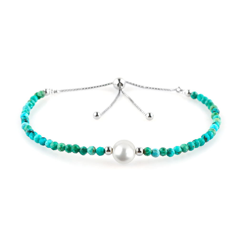 CRYSTALIS natural turquoise beads slider bracelet on wrist, showcasing vibrant color and sparkle