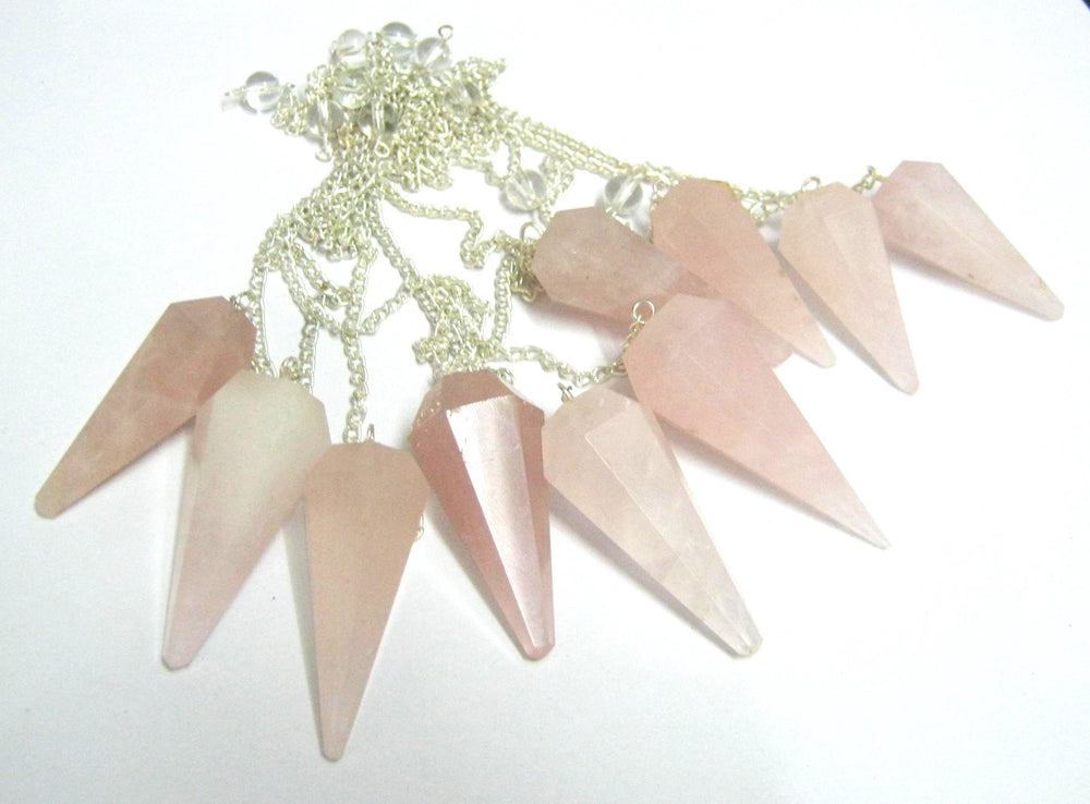 CRYSTALMIRACLE cone pendulum close-up highlighting polished facets for divination