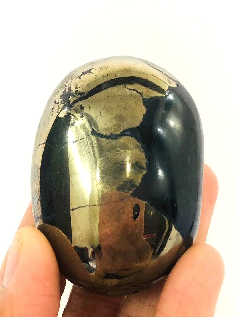 CRYSTALMIRACLE Golden Pyrite Oval PalmStone close-up for meditation focus and grounding energy.