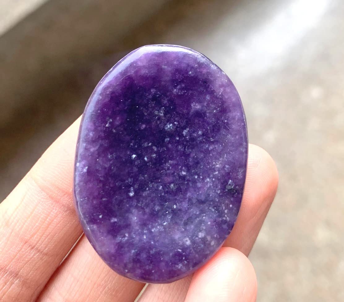 Crystalmiracle Purple Lepidolite Worry Stone in use during meditation for focus