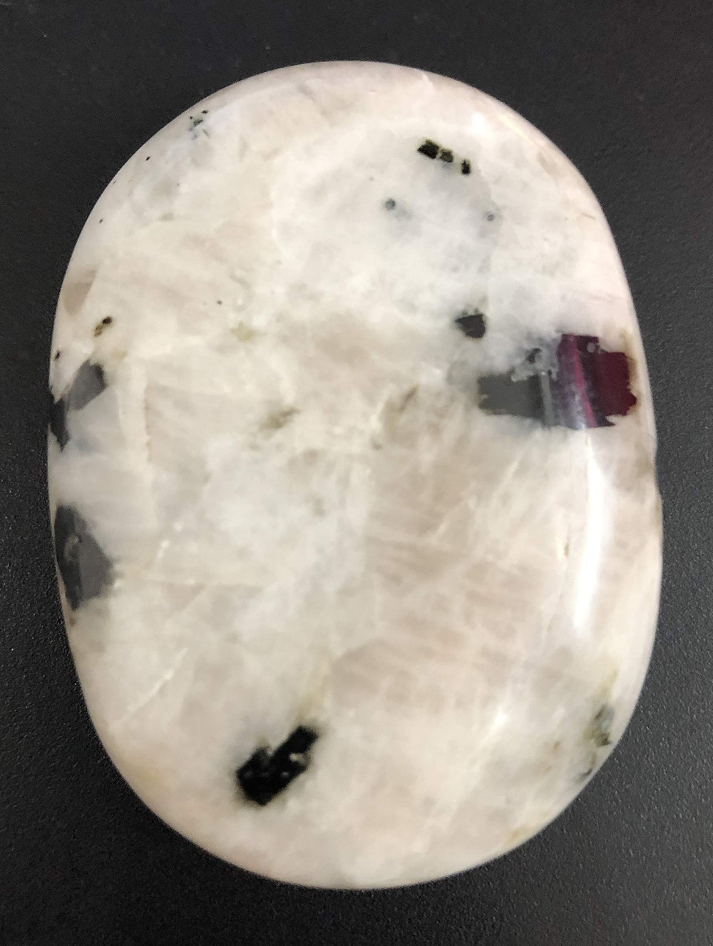 CRYSTALMIRACLE Rainbow Moonstone handheld palmstone for chakra balancing rituals.