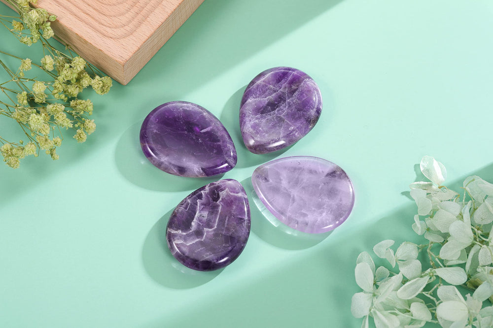 CrystalTears amethyst palm stone displaying rich purple hues for grounding moments