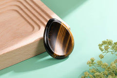 CrystalTears tiger's eye polished oval stone promotes calm and clear decisions