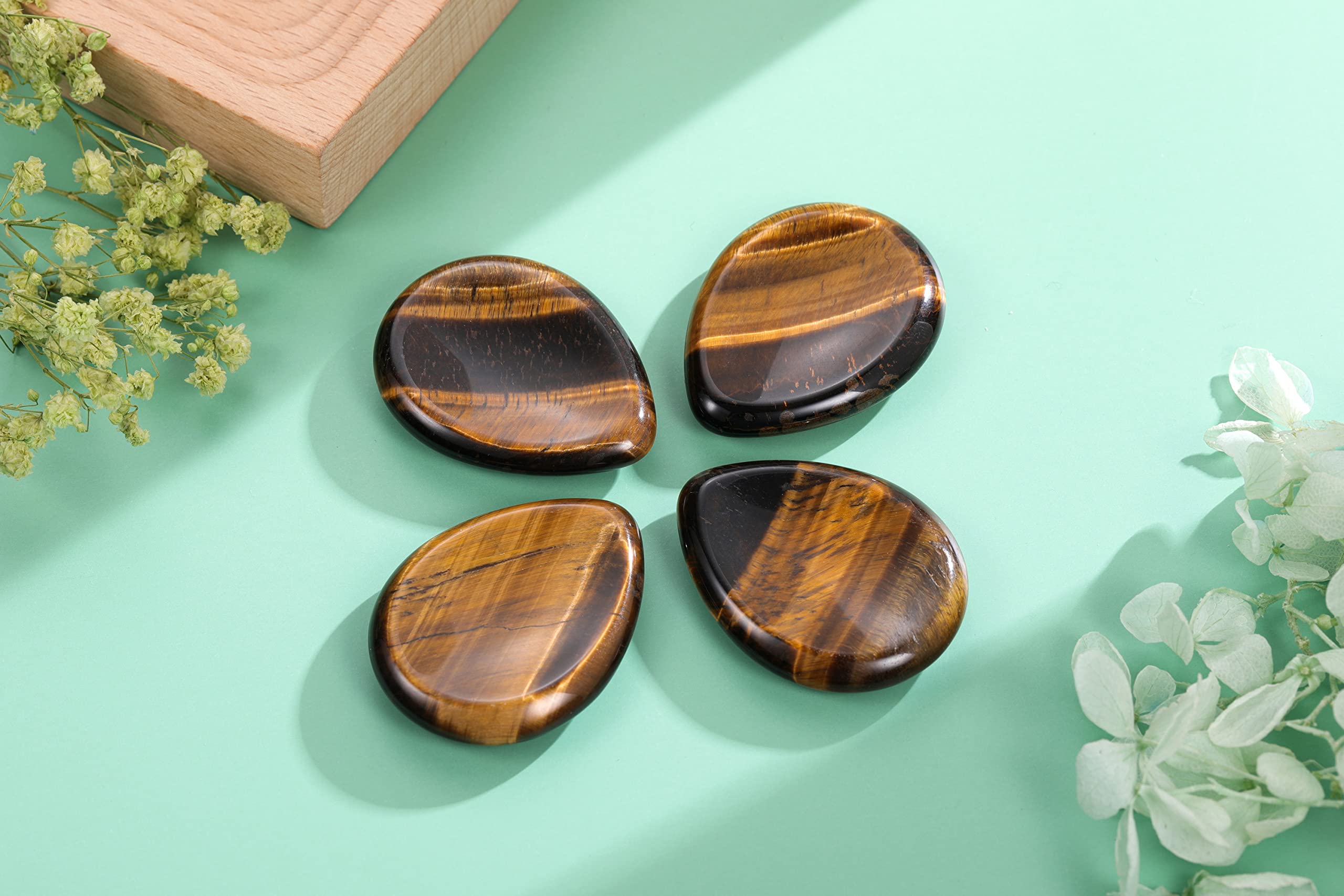CrystalTears tiger's eye palm stone held for calm focus during busy days
