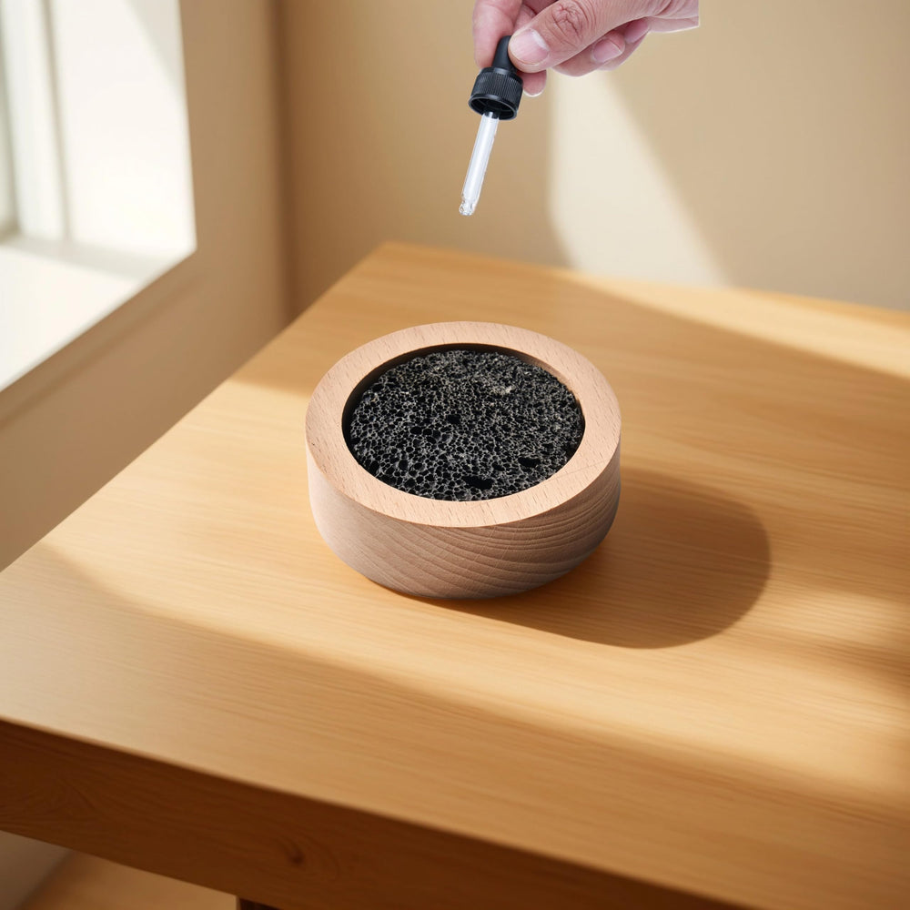 CUIYKAI lava rock diffuser showing oil drops application.