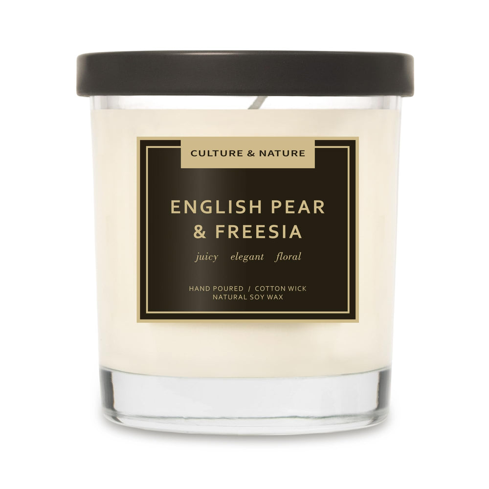 Culture & Nature soy candle in pear-freesia jar enhances cozy living room ambiance.