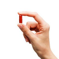 Cumlaude Serotogyn 60 capsules in use with a glass of water, easy daily routine.