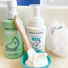 Dabble & Dollop 3-in-1 bottle illustrating versatile wash, bubbles, shampoo for family bath