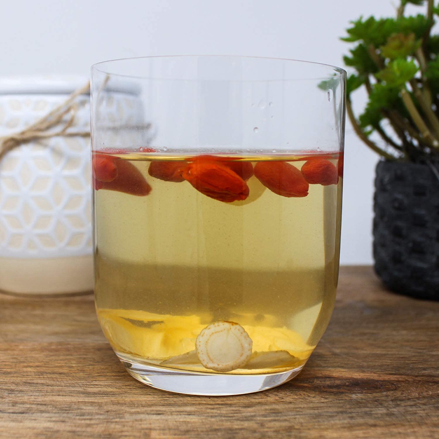 DABC OAK LAND ginseng slices being steeped to release aroma.