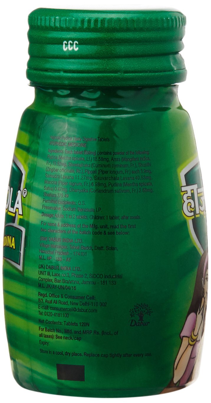 Dabur Hajmola Pudina tablet close-up, minty flavor for post-meal enjoyment.
