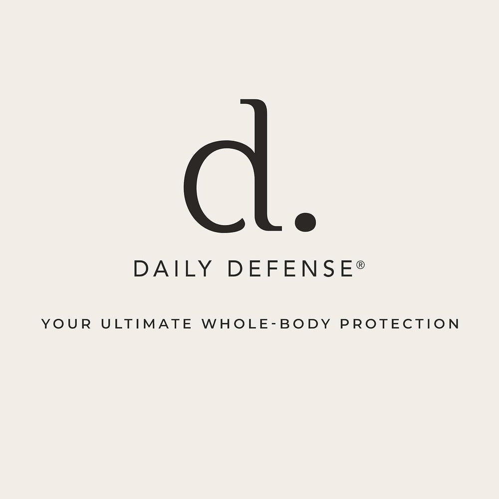 Daily Defense bottle next to glass of water suggests a daily ritual.