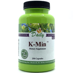 Daily Manufacturing K-Min capsule closeup, vegan calcium source for daily nutrition.