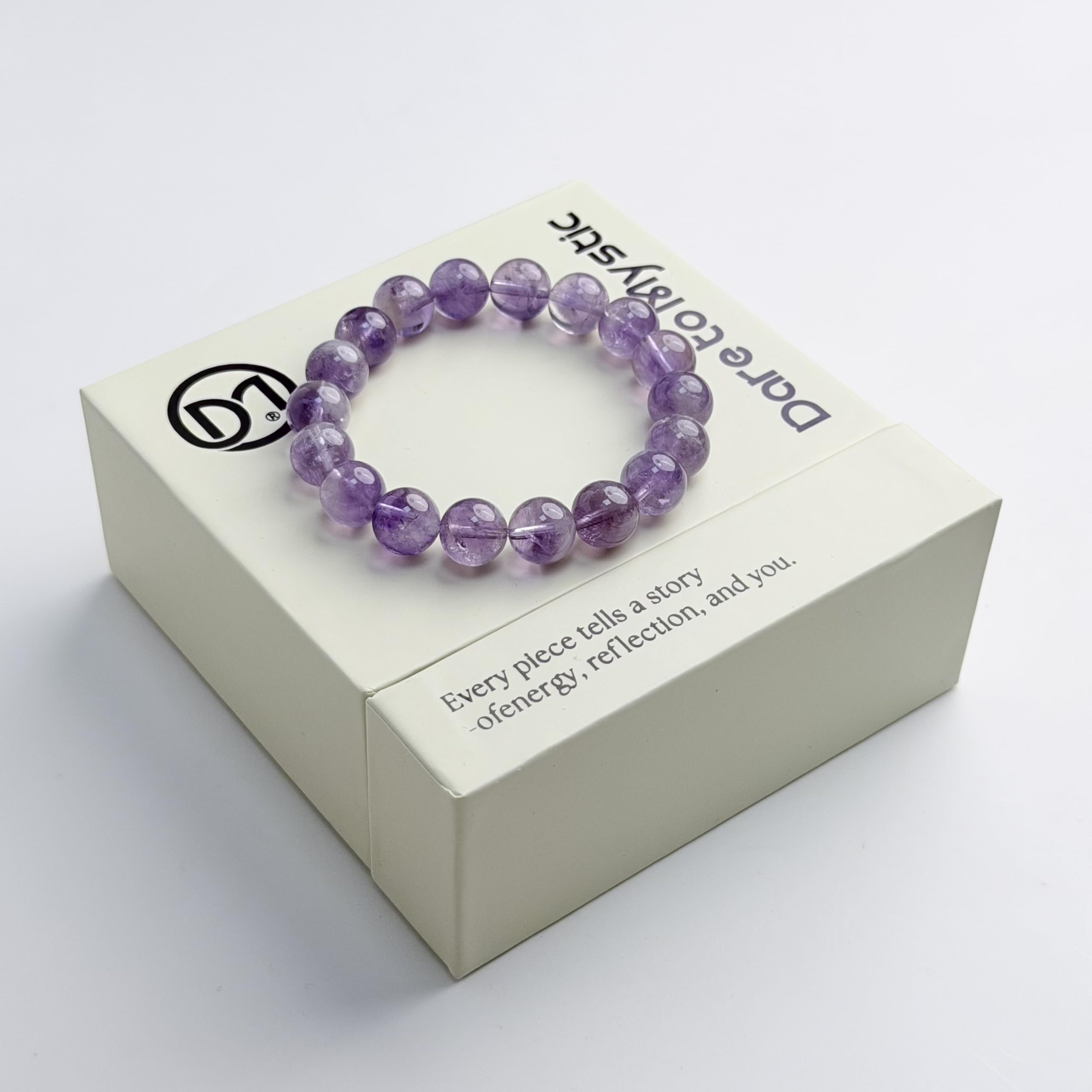 Dare to Mystic amethyst rutilated quartz bracelet close-up on wrist with clear beads