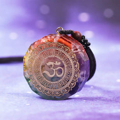 Cross-section Day Day Up orgonite pendant reveals piezo element inside.